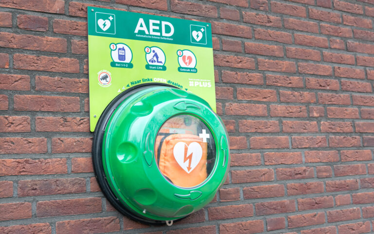 Automated external defibrillator on a wall